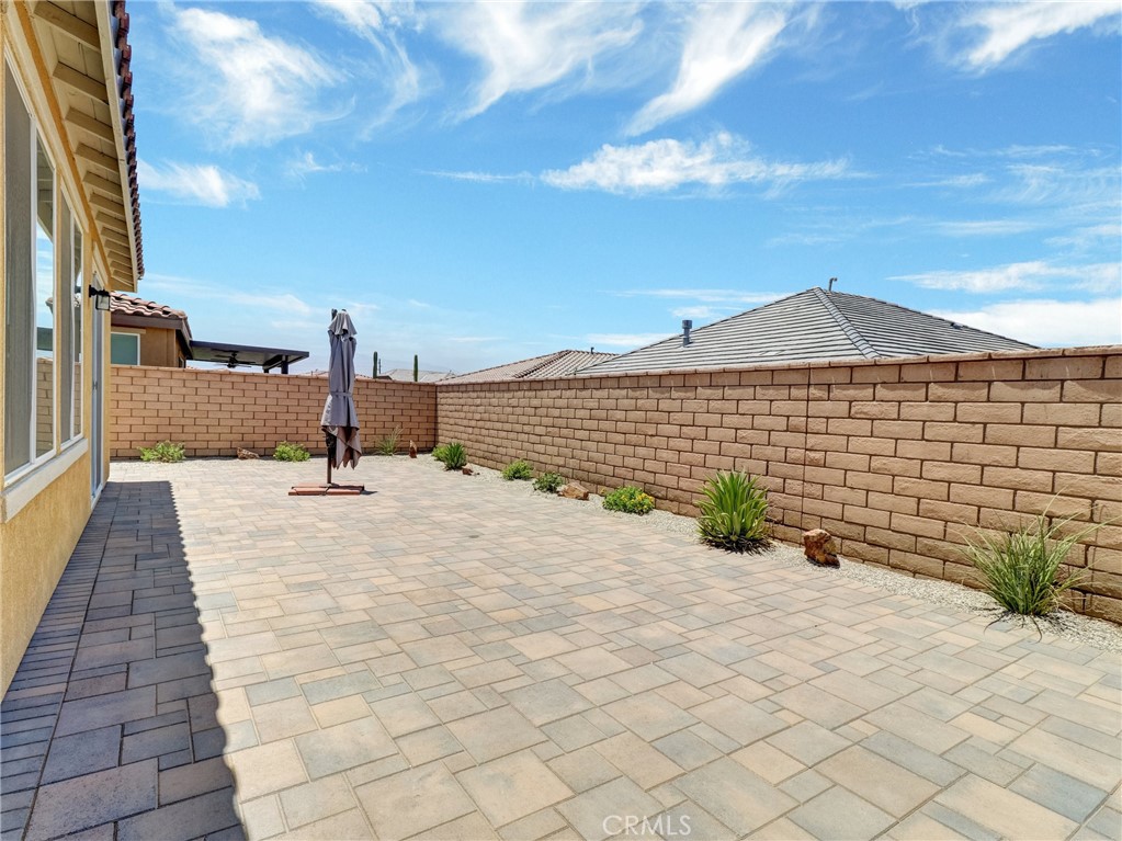 43885 Arancia Way Indio, CA 92203 - Photo 18 of 26 a front view of a house with a yard