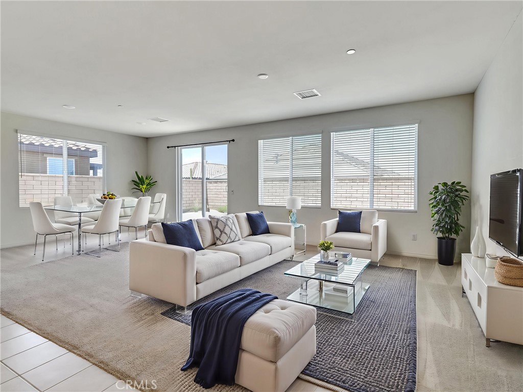 43885 Arancia Way Indio, CA 92203 - Photo 2 of 26 a living room with furniture and a large window
