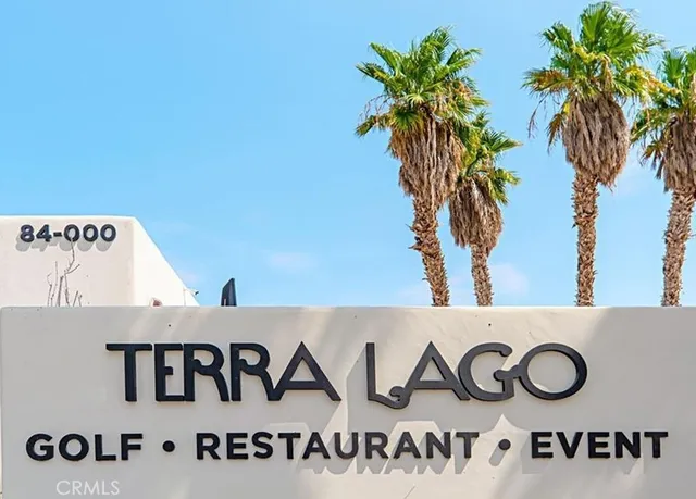 a view of kitchen with a white wall and a potted plant