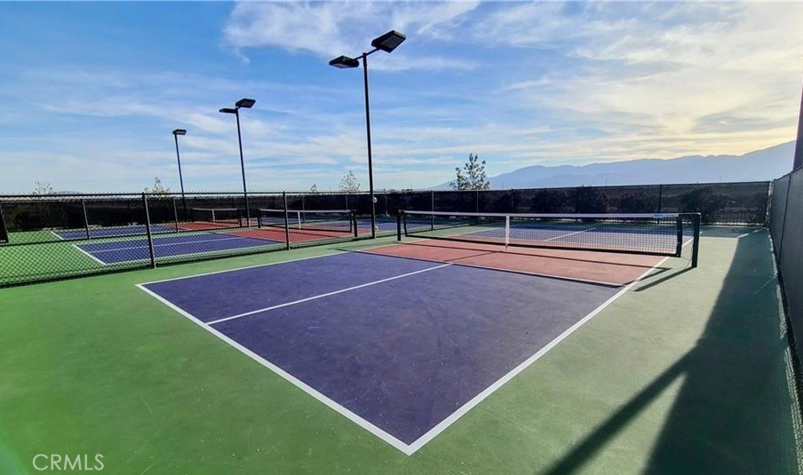 43885 Arancia Way Indio, CA 92203 - Photo 24 of 26 a view of an outdoor space and tennis court
