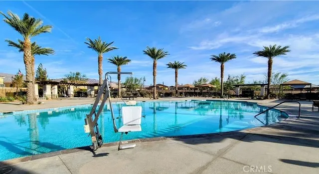 a view of a swimming pool with a table and chairs