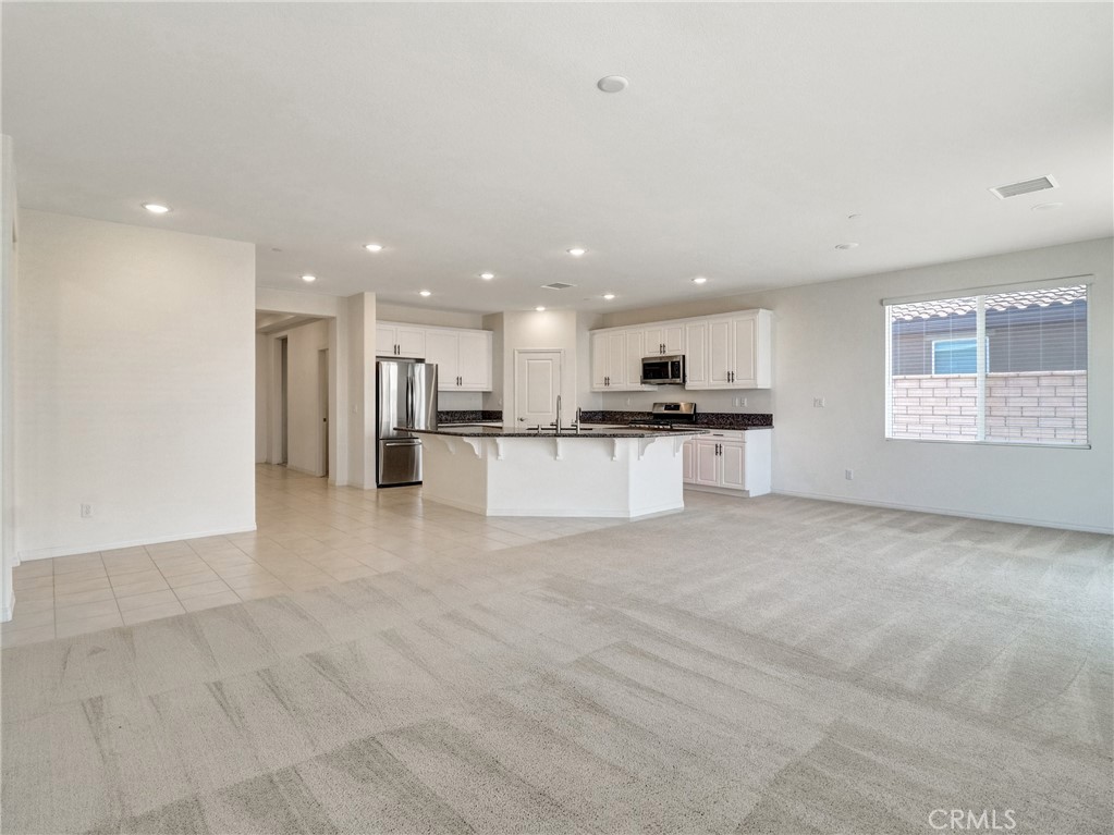 43885 Arancia Way Indio, CA 92203 - Photo 7 of 26 a view of kitchen with refrigerator sink and stove
