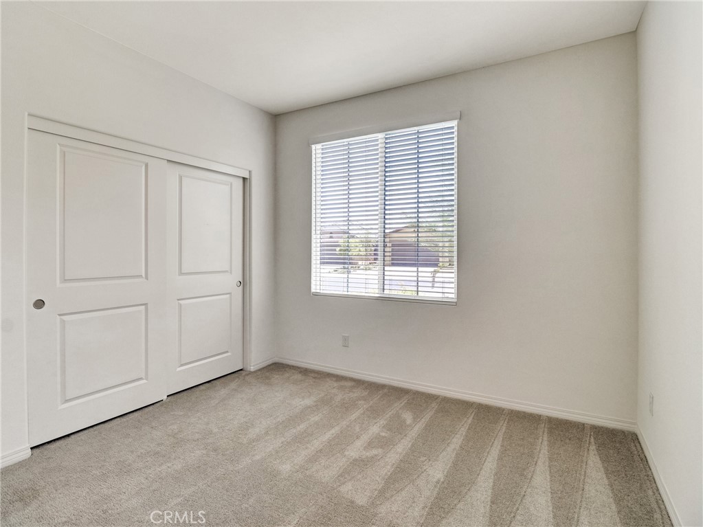43885 Arancia Way Indio, CA 92203 - Photo 10 of 26 an empty room with windows
