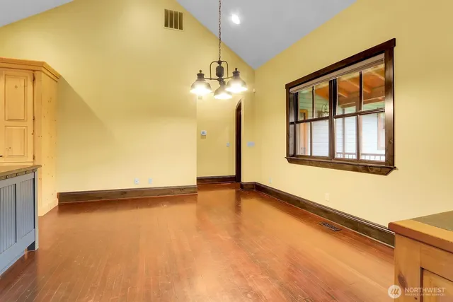 a living room with a bed furniture and a window