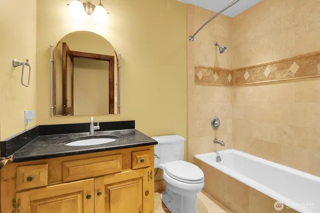 a view of a house with a yard and sitting area