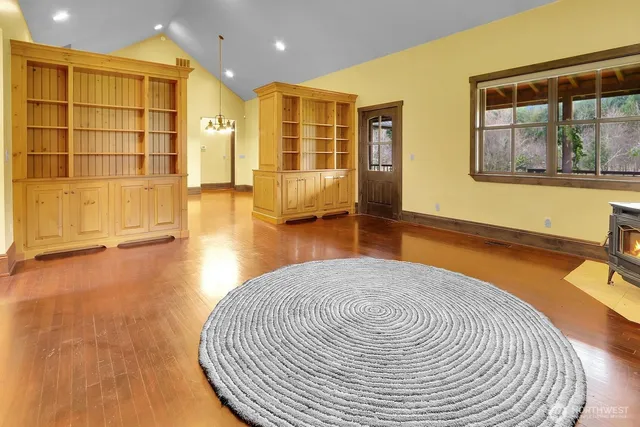 a view of a livingroom with furniture and wooden floor