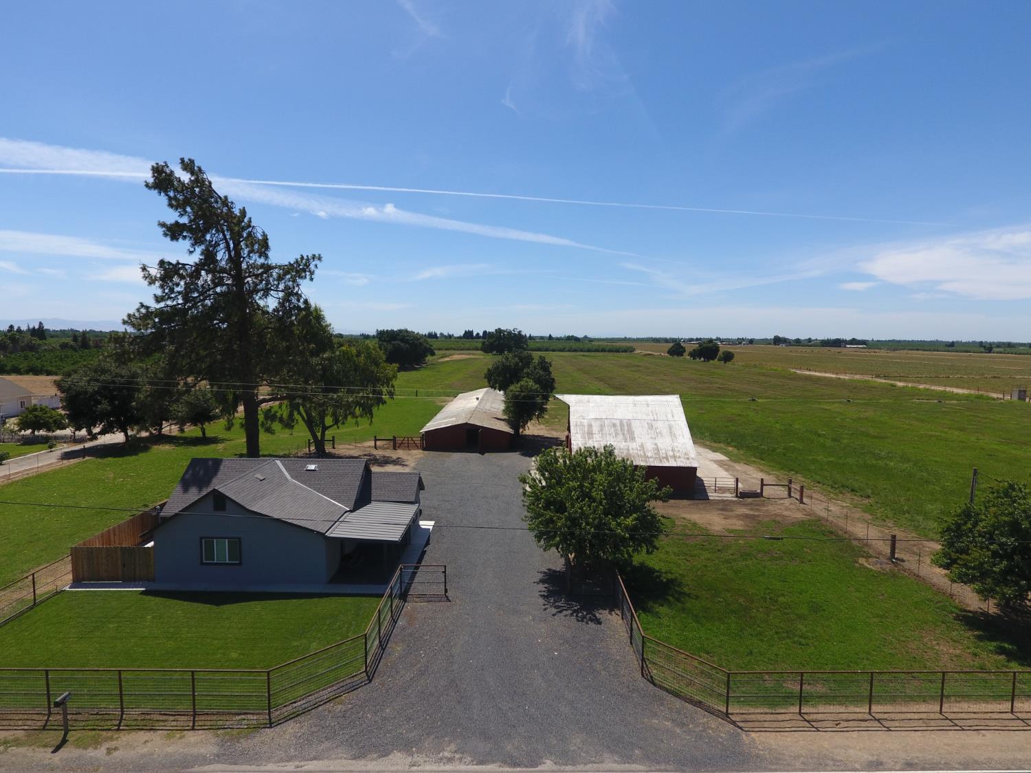 20383 Sutliff Road Escalon, CA 95320 - Photo 1 of 65 a view of a garden with lawn chairs