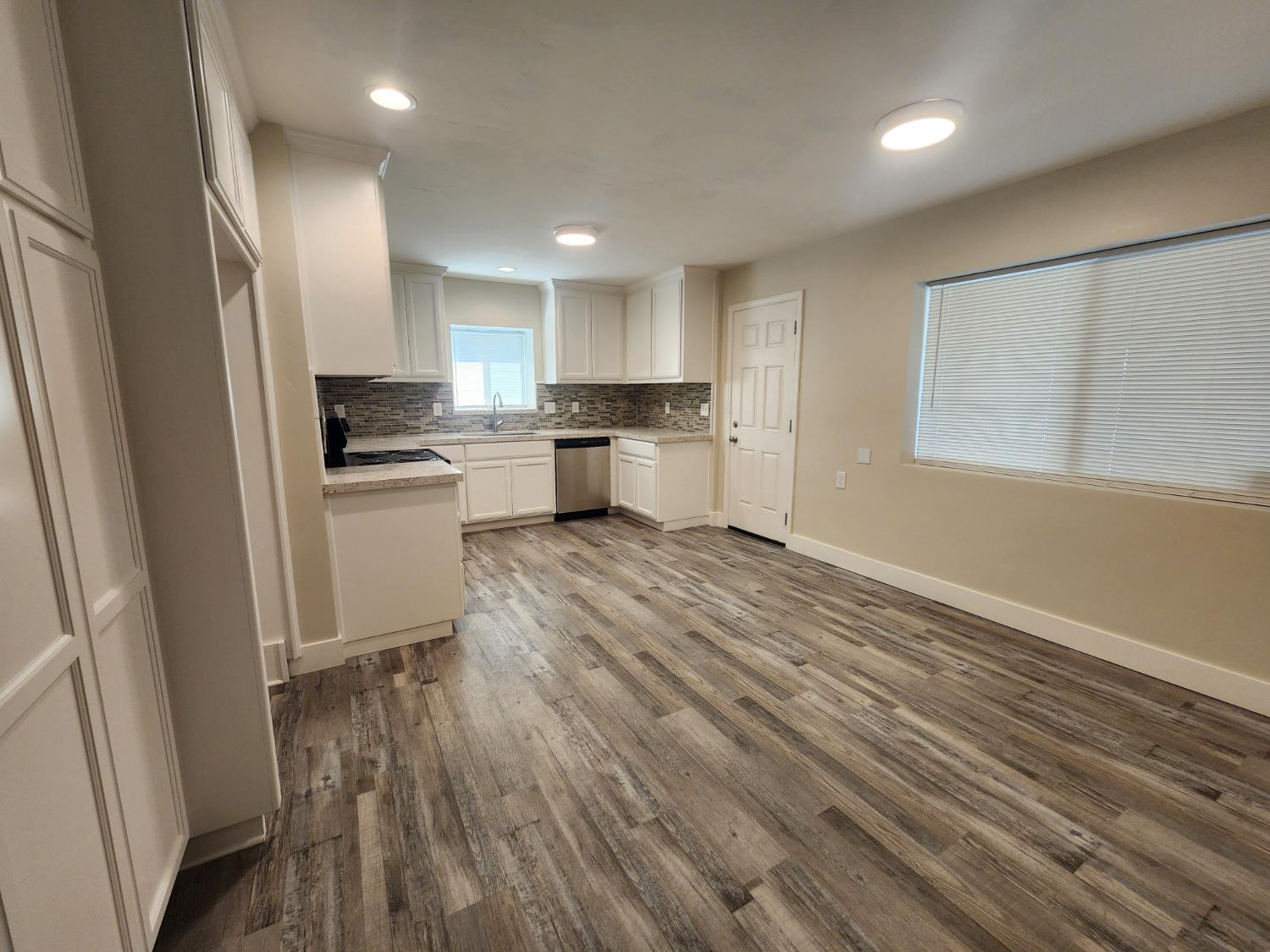 20383 Sutliff Road Escalon, CA 95320 - Photo 22 of 65 a kitchen with a refrigerator a sink and a stove top oven