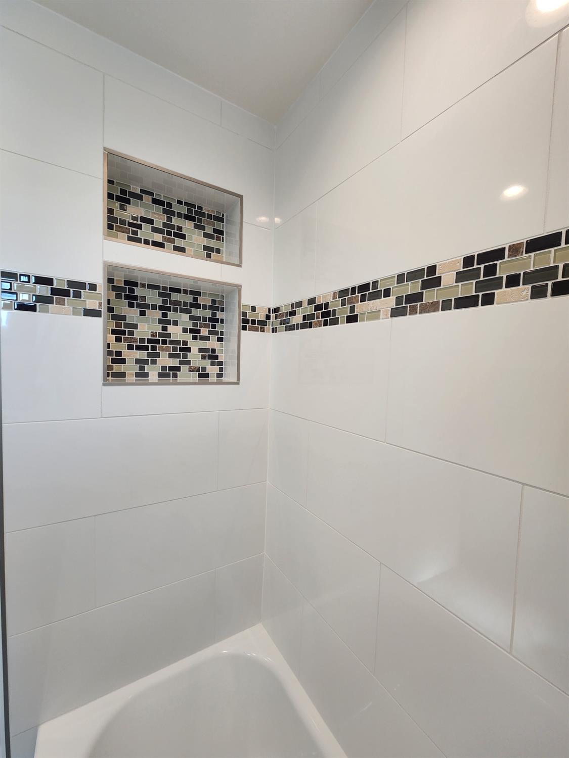 20383 Sutliff Road Escalon, CA 95320 - Photo 29 of 65 a bathroom with a bathtub and a shower
