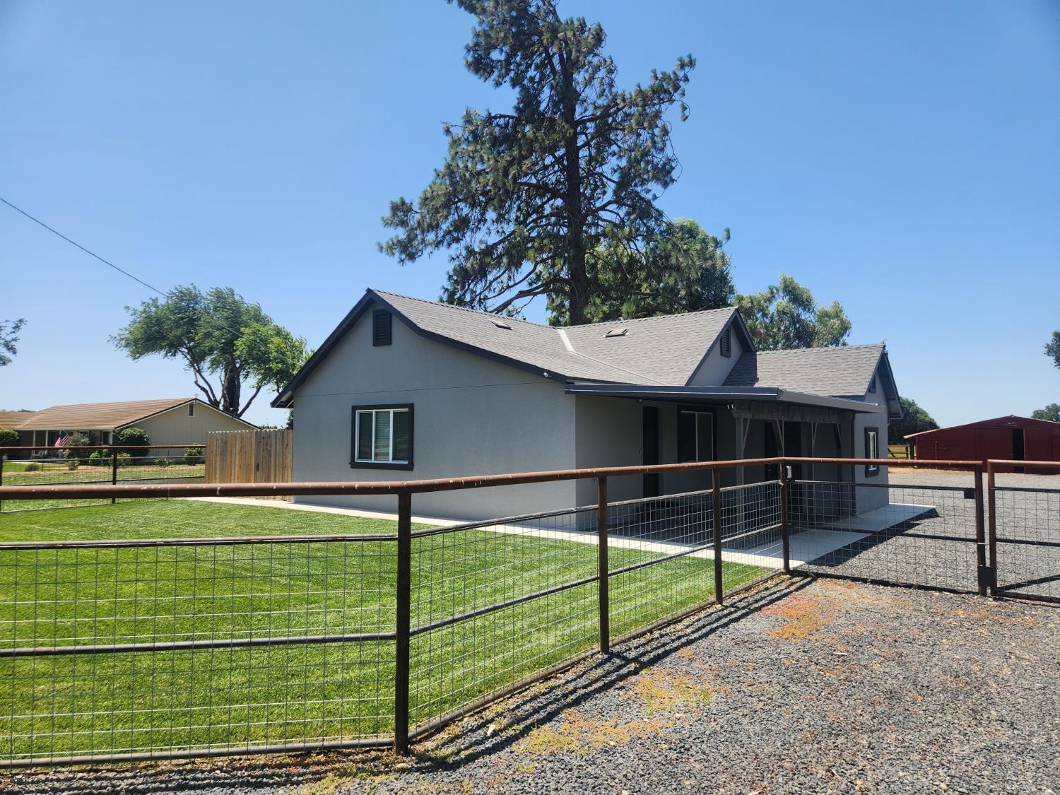 20383 Sutliff Road Escalon, CA 95320 - Photo 3 of 65 a view of a house with a yard