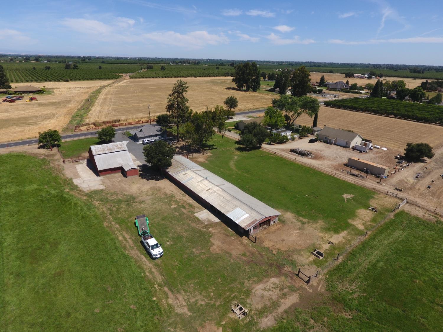 20383 Sutliff Road Escalon, CA 95320 - Photo 55 of 65 an aerial view of a house with a garden and lake view
