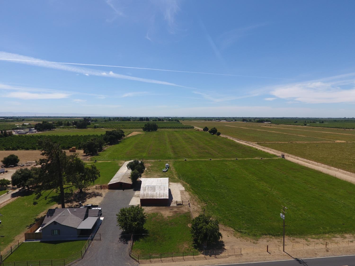 20383 Sutliff Road Escalon, CA 95320 - Photo 58 of 65 a view of a lake with a yard