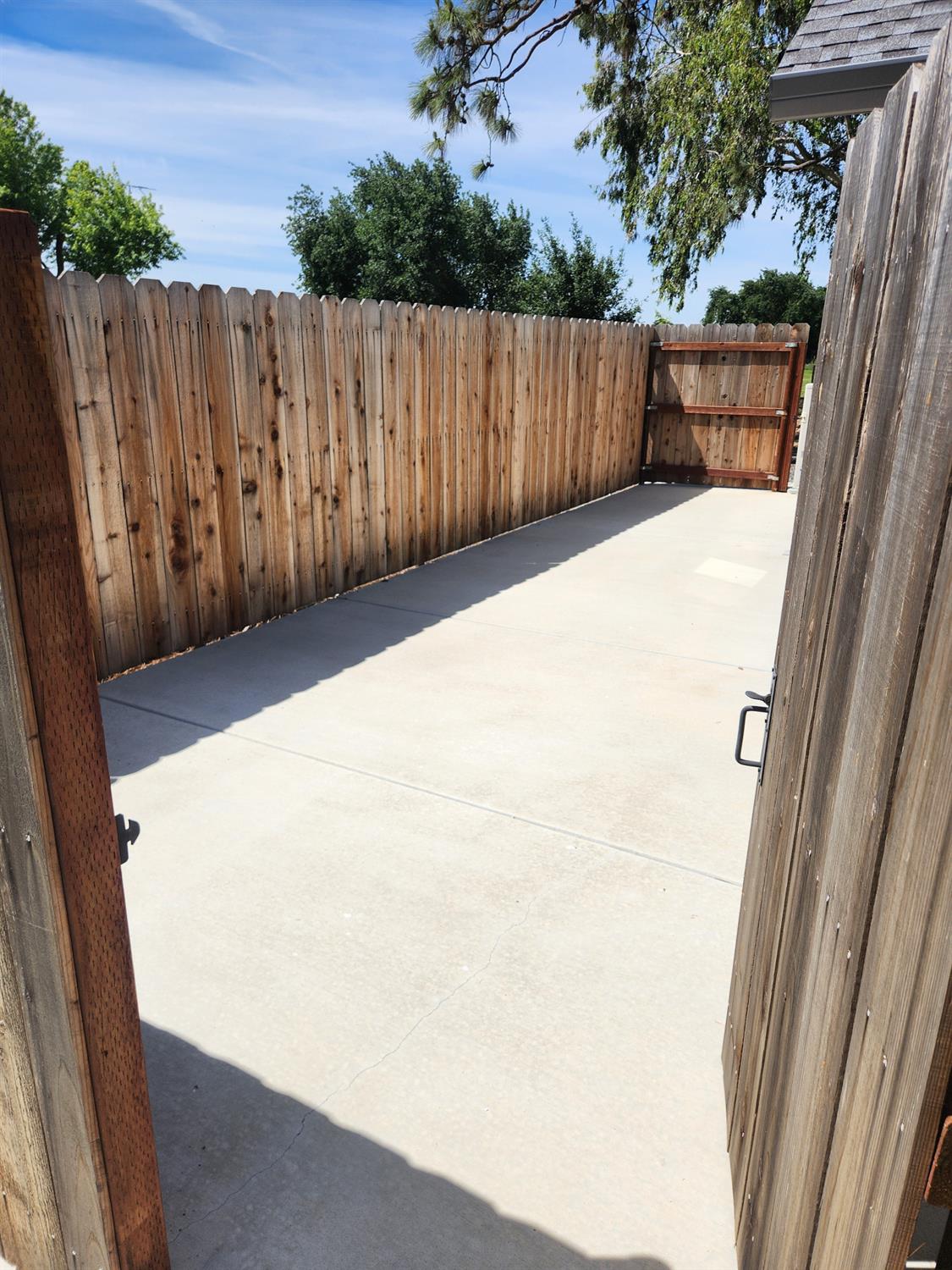 20383 Sutliff Road Escalon, CA 95320 - Photo 6 of 65 a view of backyard with wooden fence