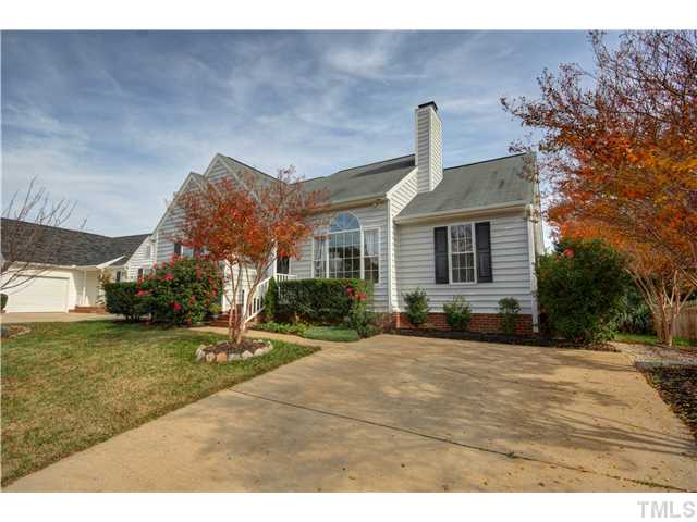 9509 Dawnshire Road Raleigh, NC 27615 - Photo 1 of 24 a front view of a house with a yard and garage