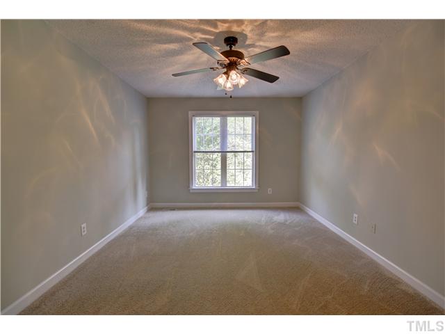 9509 Dawnshire Road Raleigh, NC 27615 - Photo 12 of 24 a view of a livingroom with a ceiling fan and window