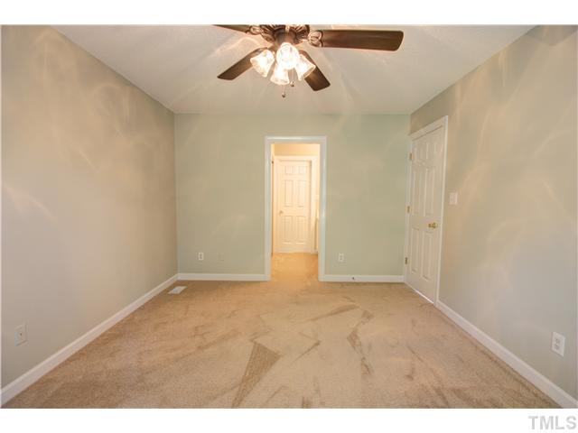 9509 Dawnshire Road Raleigh, NC 27615 - Photo 13 of 24 a view of an empty room and chandelier fan