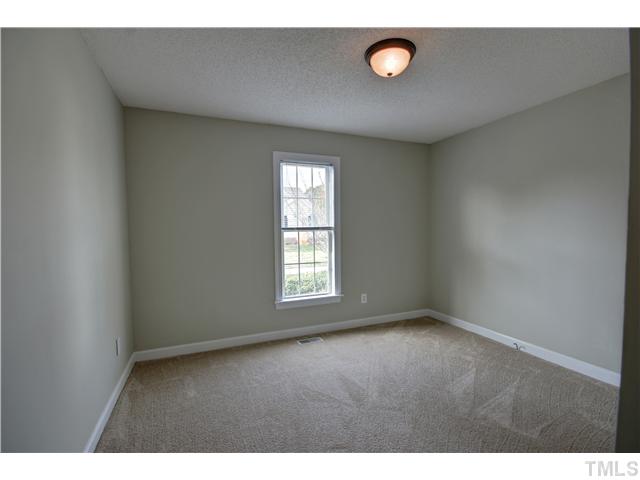 9509 Dawnshire Road Raleigh, NC 27615 - Photo 15 of 24 a view of an empty room with a window