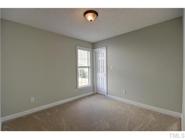 9509 Dawnshire Road Raleigh, NC 27615 - Photo 19 of 24 a view of an empty room with a window