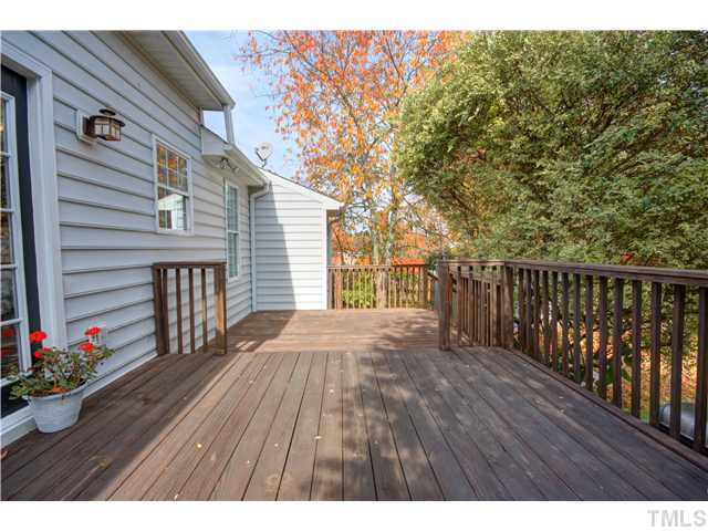 9509 Dawnshire Road Raleigh, NC 27615 - Photo 24 of 24 a view of backyard with a deck and wooden floor