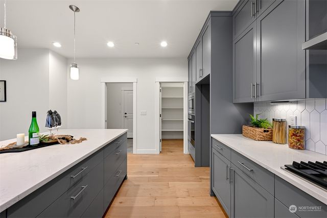 a kitchen with a sink and refrigerator