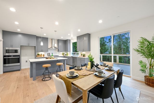 a view of a dining room with furniture window and outside view