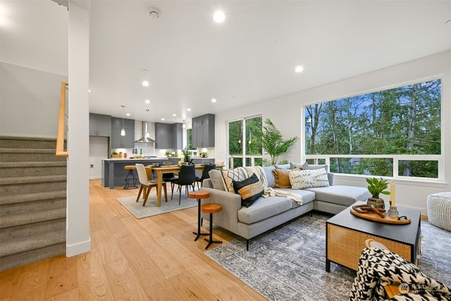 a living room with furniture and a table