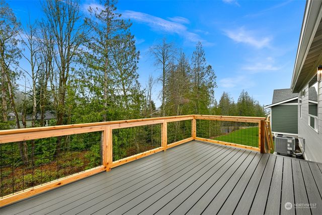 a view of balcony with wooden floor and fence