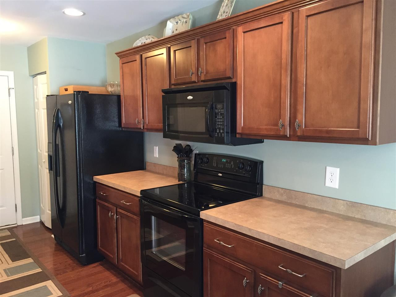 1925 Raj Drive Durham, NC 27703 - Photo 9 of 25 Beautiful cabinets with molding. Nice matching black appliances and lots of counter space! Kitchen