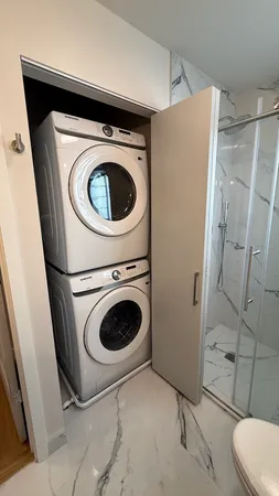 a utility room with dryer and washer