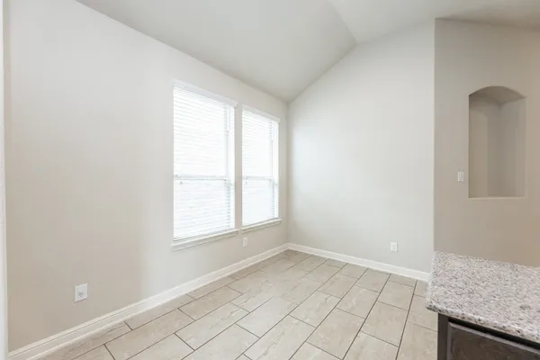 a bathroom with a tub shower and sink