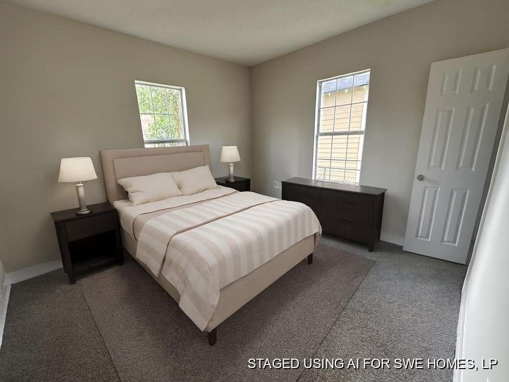 4520 Falls Street Houston, TX 77026 - Photo 8 of 11 a bedroom with a bed and a window