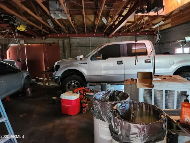 a kitchen with a sink appliances and cabinets