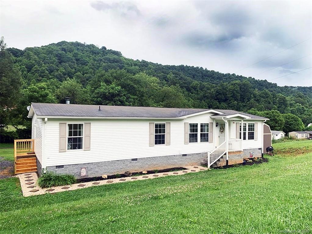 2632 Beaverdam Road Canton, NC 28716 - Photo 1 of 18 a view of a house with a backyard