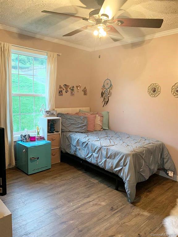 2632 Beaverdam Road Canton, NC 28716 - Photo 12 of 18 a bedroom with a bed and a window