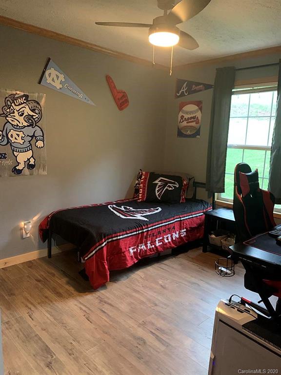 2632 Beaverdam Road Canton, NC 28716 - Photo 15 of 18 a bedroom with a bed and a window