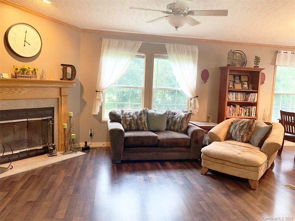 2632 Beaverdam Road Canton, NC 28716 - Photo 7 of 18 a living room with furniture a window and a fireplace