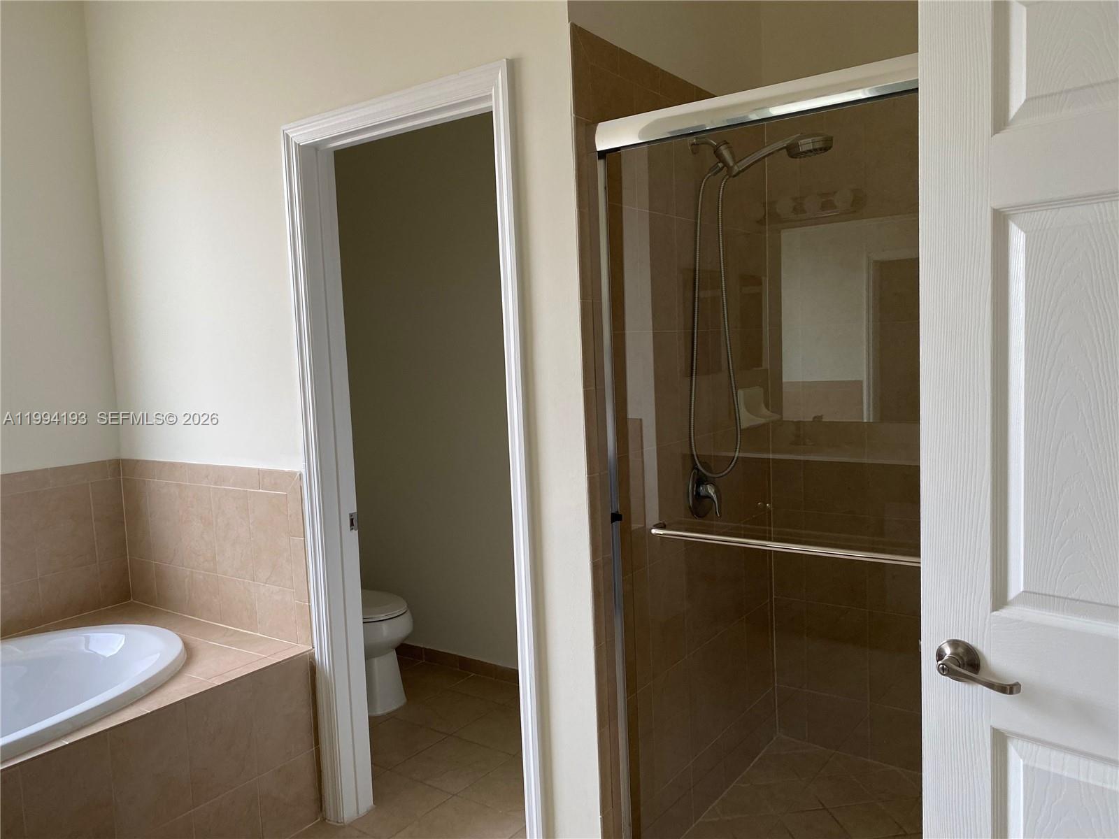 17001 Southwest 90th Terrace, Unit 1 Miami, FL 33196 - Photo 15 of 35 a bathroom with a granite countertop sink