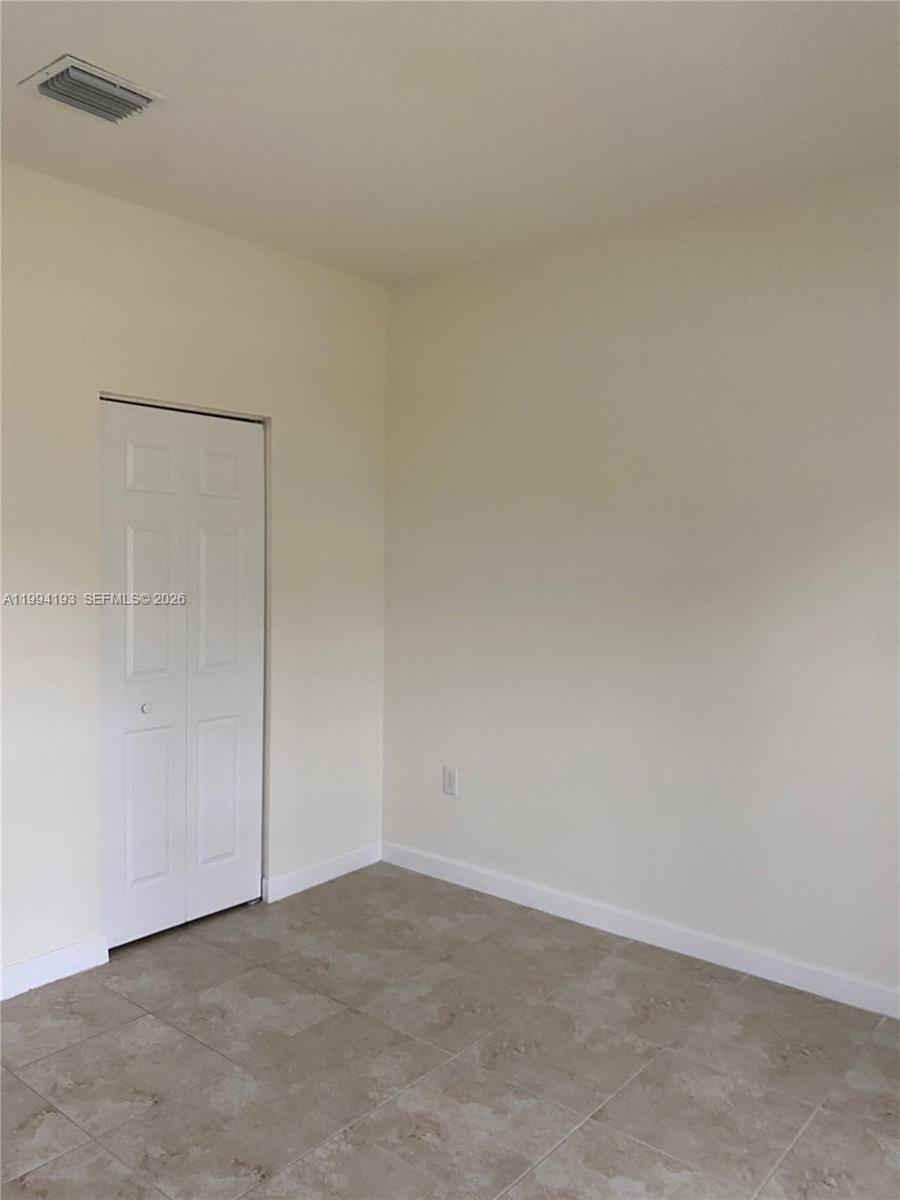17001 Southwest 90th Terrace, Unit 1 Miami, FL 33196 - Photo 21 of 35 a view of an empty room