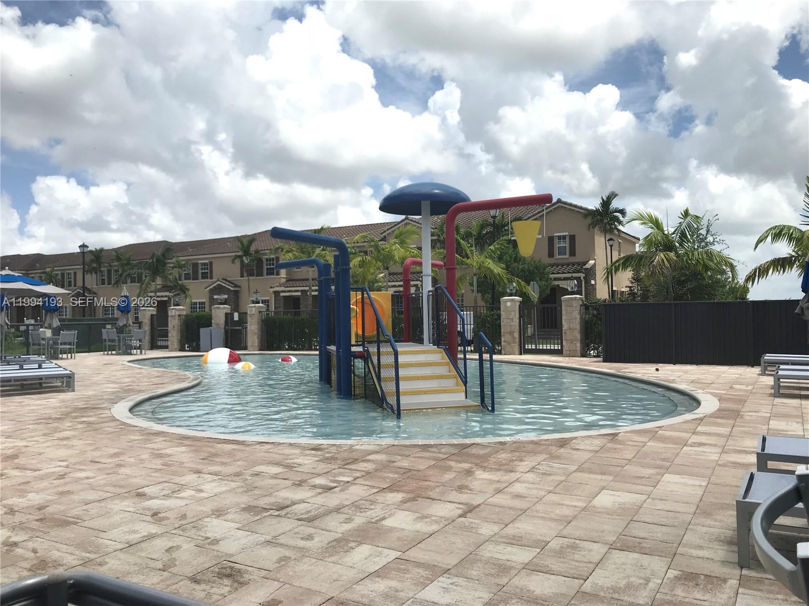 17001 Southwest 90th Terrace, Unit 1 Miami, FL 33196 - Photo 28 of 35 a view of outdoor space with seating space