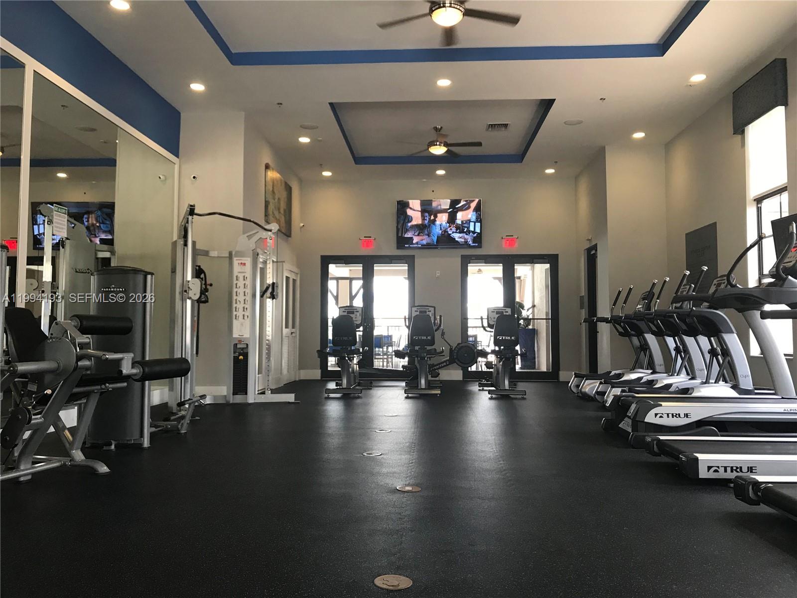 17001 Southwest 90th Terrace, Unit 1 Miami, FL 33196 - Photo 30 of 35 a view of a room with gym equipment