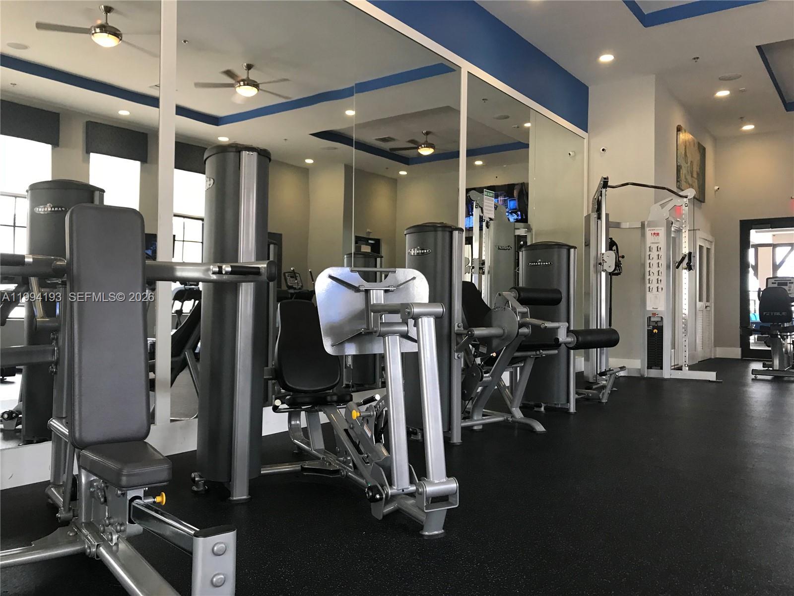 17001 Southwest 90th Terrace, Unit 1 Miami, FL 33196 - Photo 32 of 35 a view of a room with gym equipment