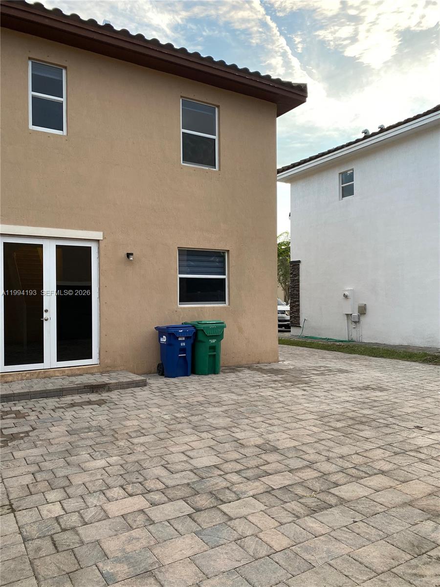 17001 Southwest 90th Terrace, Unit 1 Miami, FL 33196 - Photo 5 of 35 a view of a house with backyard