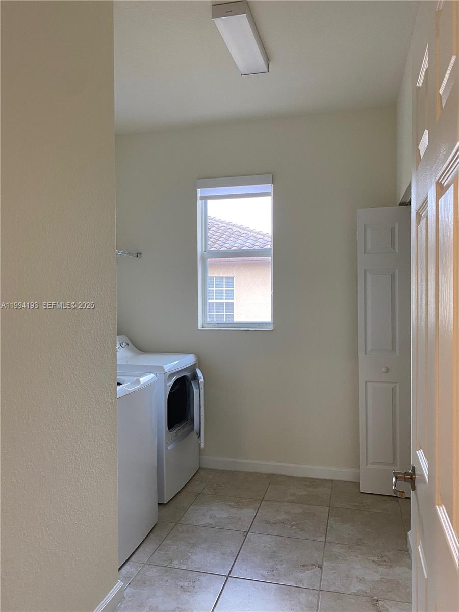 17001 Southwest 90th Terrace, Unit 1 Miami, FL 33196 - Photo 10 of 35 an empty room with windows