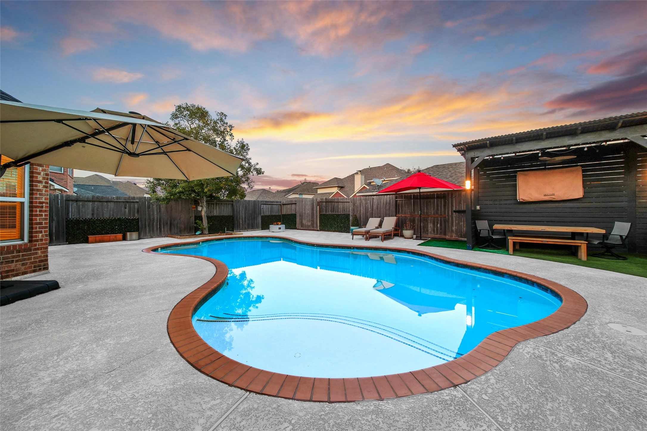 20730 Windrose Bend Drive Spring, TX 77379 - Photo 12 of 50 a view of a swimming pool with a lounge chair
