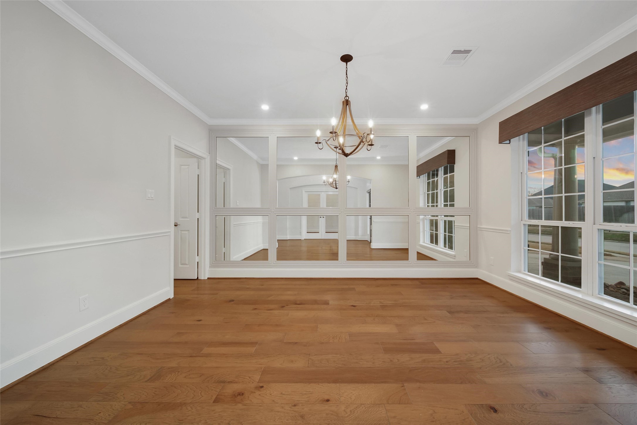 20730 Windrose Bend Drive Spring, TX 77379 - Photo 15 of 50 a view of an empty room with wooden floor and a window