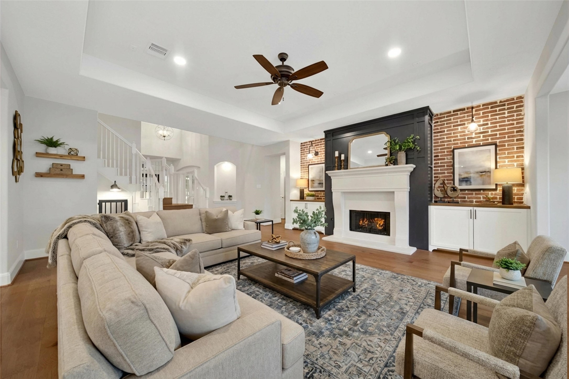 20730 Windrose Bend Drive Spring, TX 77379 - Photo 20 of 50 a living room with furniture a fireplace and a large window