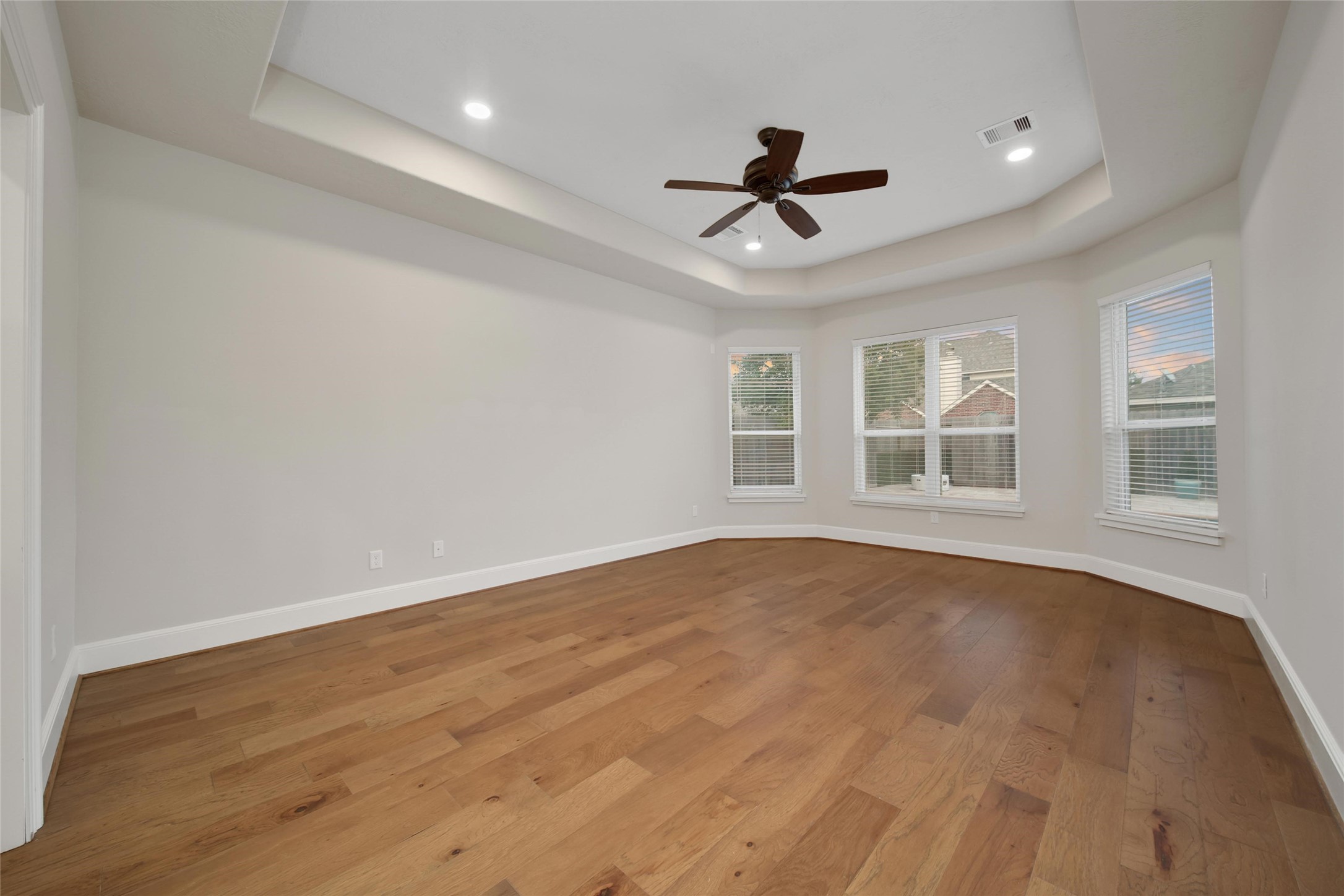 20730 Windrose Bend Drive Spring, TX 77379 - Photo 26 of 50 a view of an empty room with a window and wooden floor