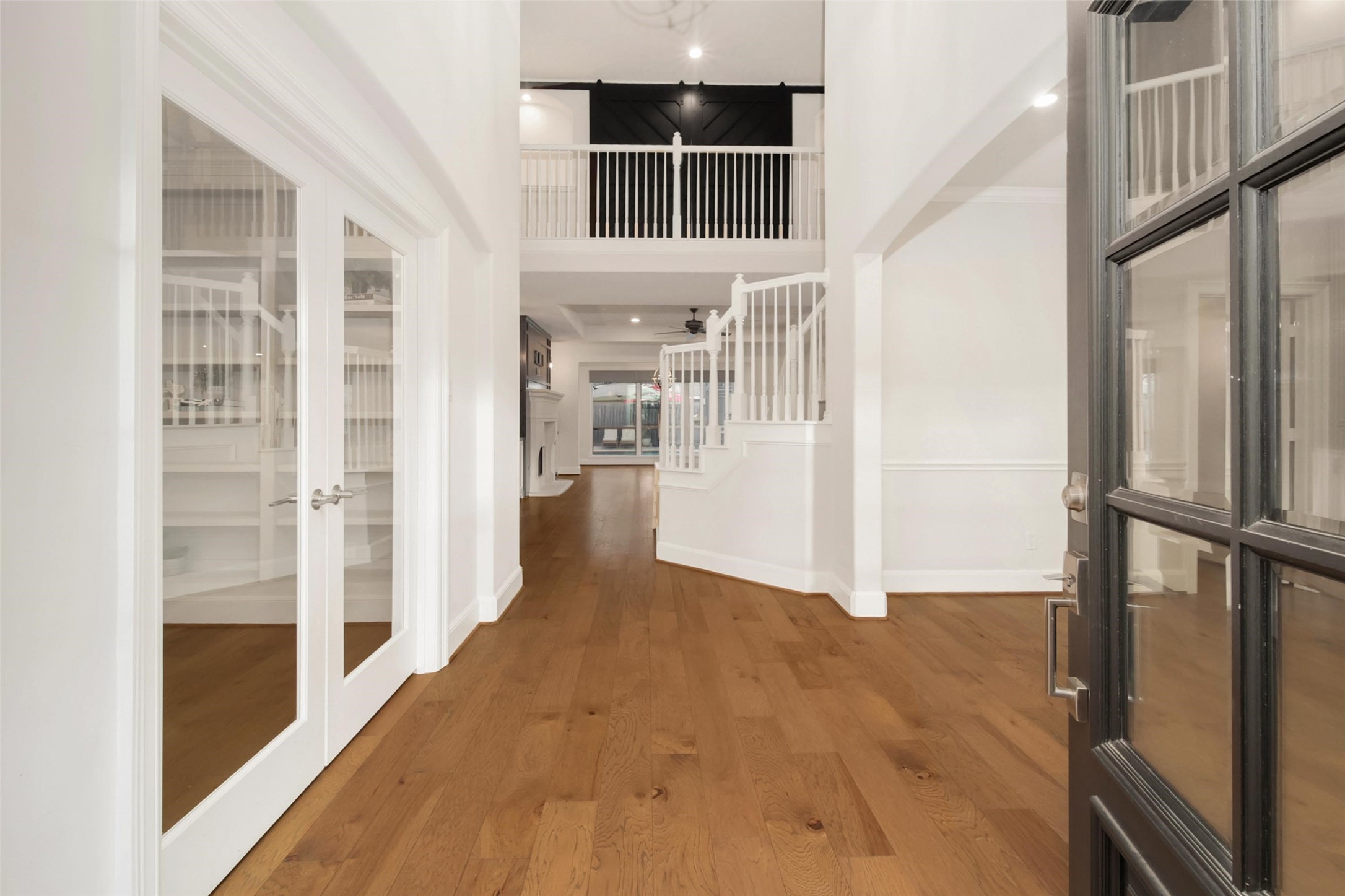 20730 Windrose Bend Drive Spring, TX 77379 - Photo 3 of 50 a view of empty room with wooden floor and cabinet