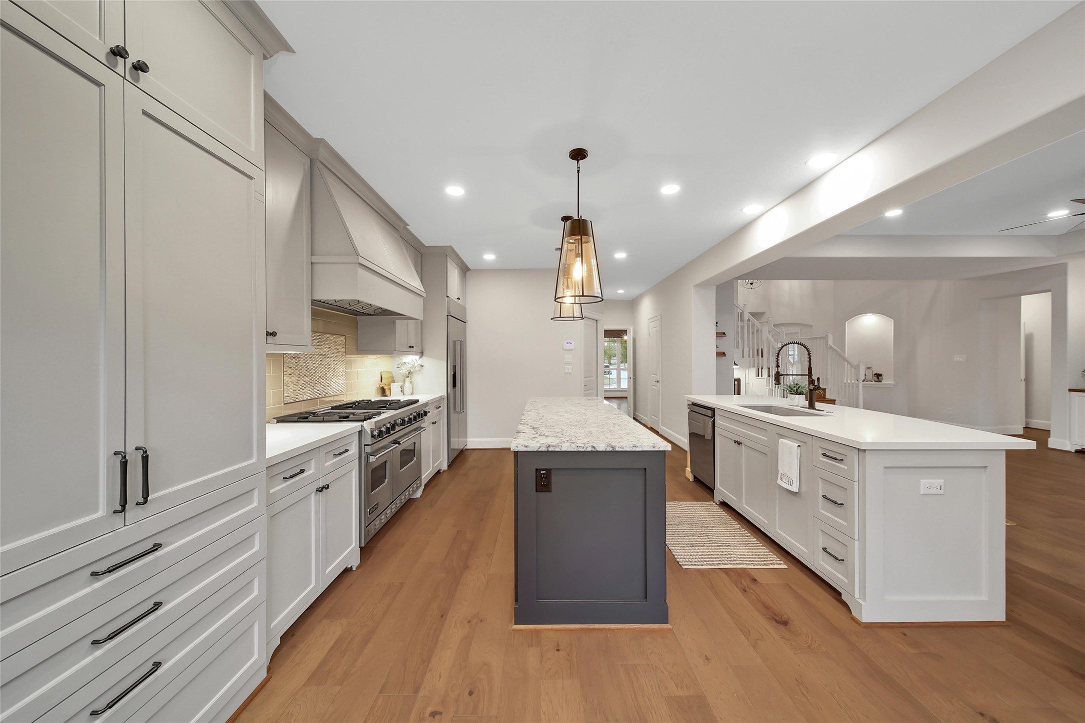 20730 Windrose Bend Drive Spring, TX 77379 - Photo 7 of 50 a large kitchen with stainless steel appliances and a sink