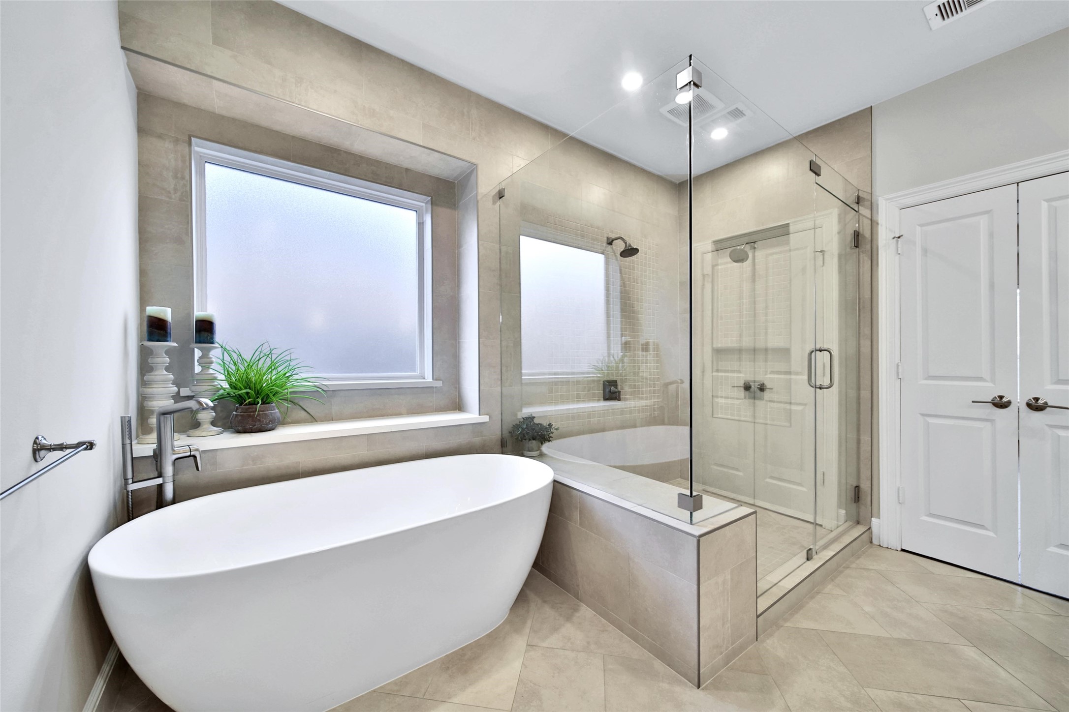 20730 Windrose Bend Drive Spring, TX 77379 - Photo 8 of 50 a white bath tub sitting in a bathroom next to a window